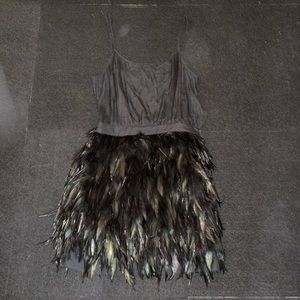 Feather mini dress with side zipper closure. Size UK 38. Black.